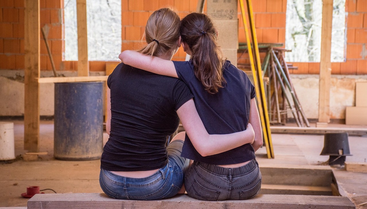 Friends constructing a home. 