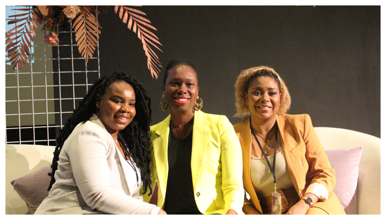 Jacqueline Mitchell, Angel Johnson, and Sandra Mosquera seated on a white couch.