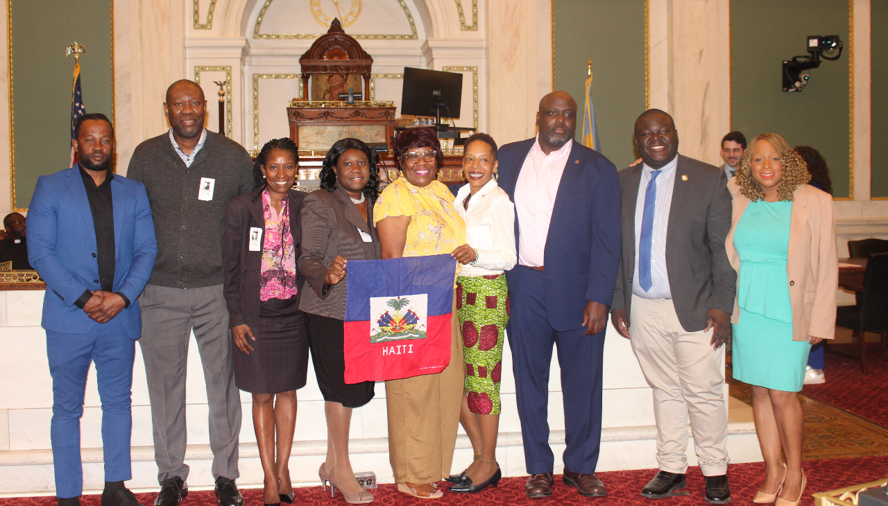 Members of the Haitian community with Councilmembers Anthony Phillips and Jamie Gauthier prior to Council hearing. Photo: Jensen Toussaint/AL DÍA News.