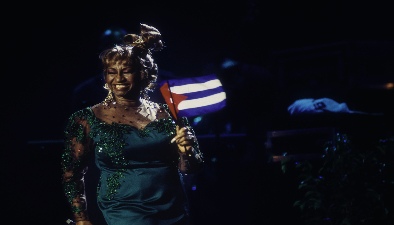 Cruz holds a Cuban flag during the 'Combinacion Perfecta' concert at Madison Square Garden, New York City, 1993. Photo: Getty Images