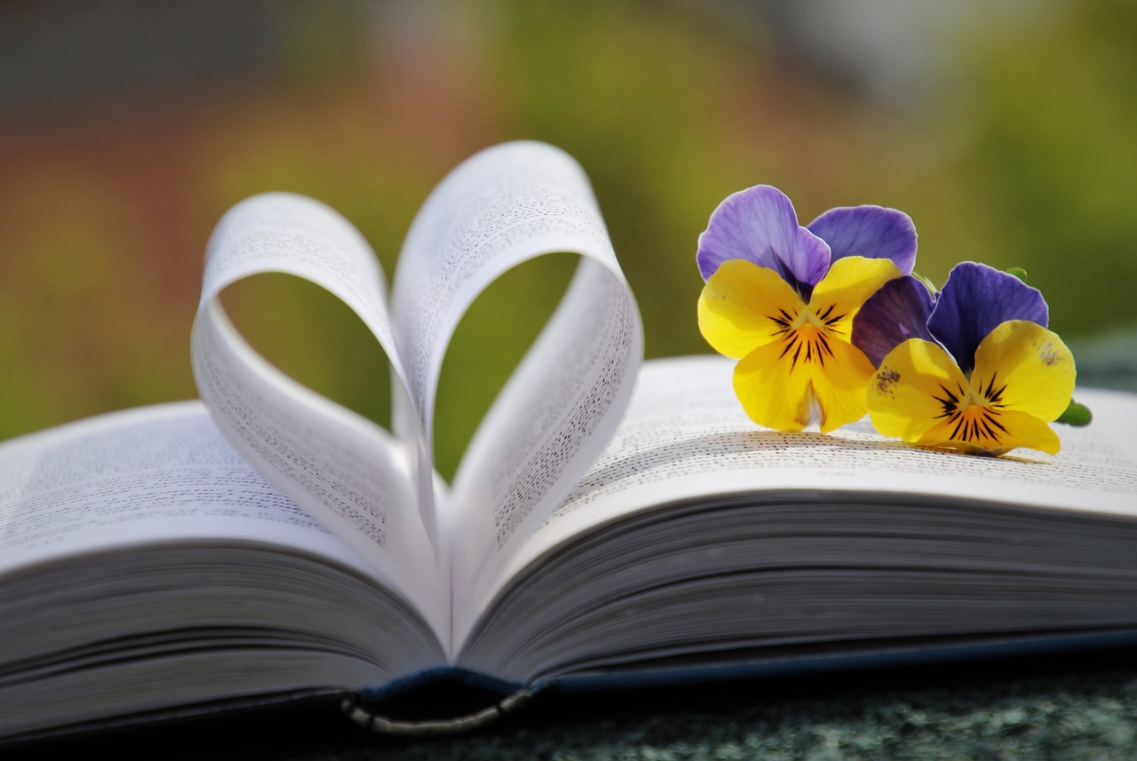 A heart made out of the pages of a book. 