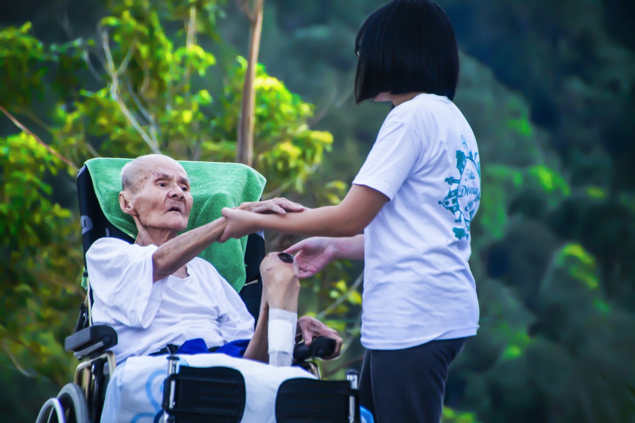 Woman taking care of an elderly patient. 