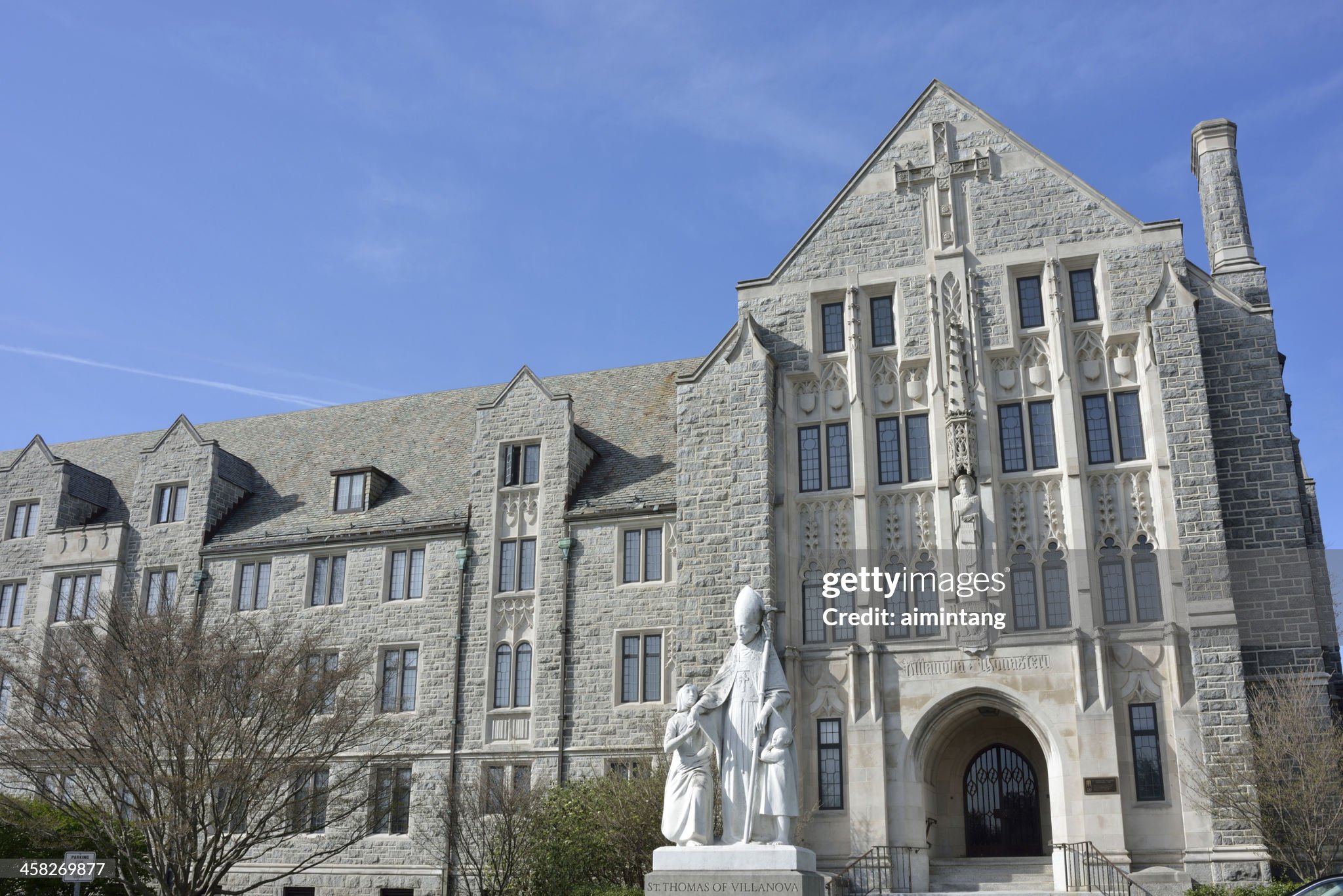 St. Thomas Monastery with the statue of St. Thomas of Villanova in front in the campus of Villanova University. Villanova University is a private Roman Catholic, Augustinian university located in Radnor Township west of Philadelphia.