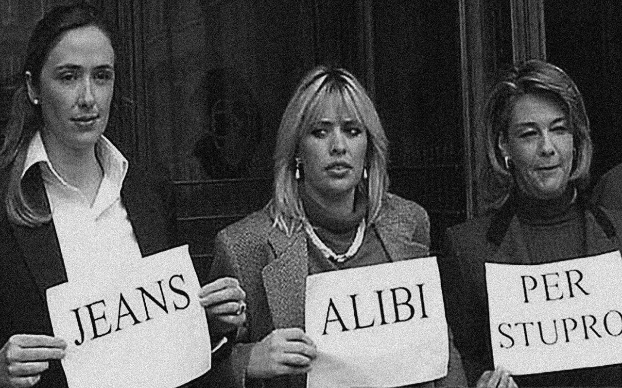 The day after the decision, women in the Italian Parliament protested by wearing jeans and holding placards that read “Jeans: An Alibi for Rape.” Courtesy: Denim Day