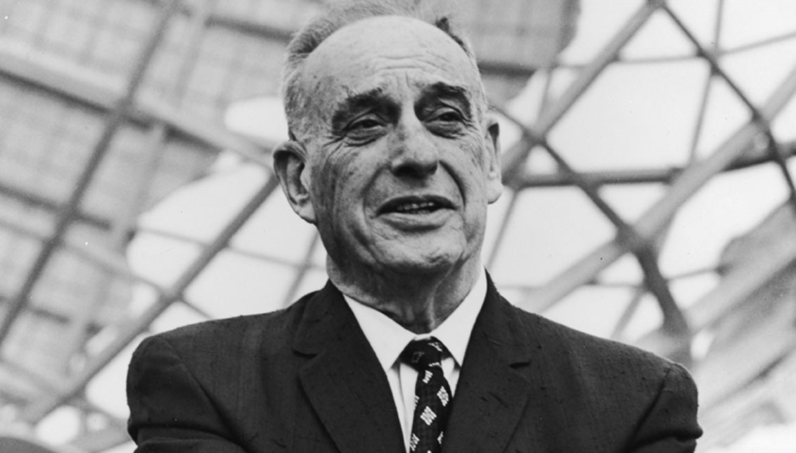 American urban planner Robert Moses (1888-1981), president of the World's Fair stands in front of the Unisphere monument at the World's Fair site in Flushing, Queens, New York City, 1964. Photo: Archive Photos / Getty Images