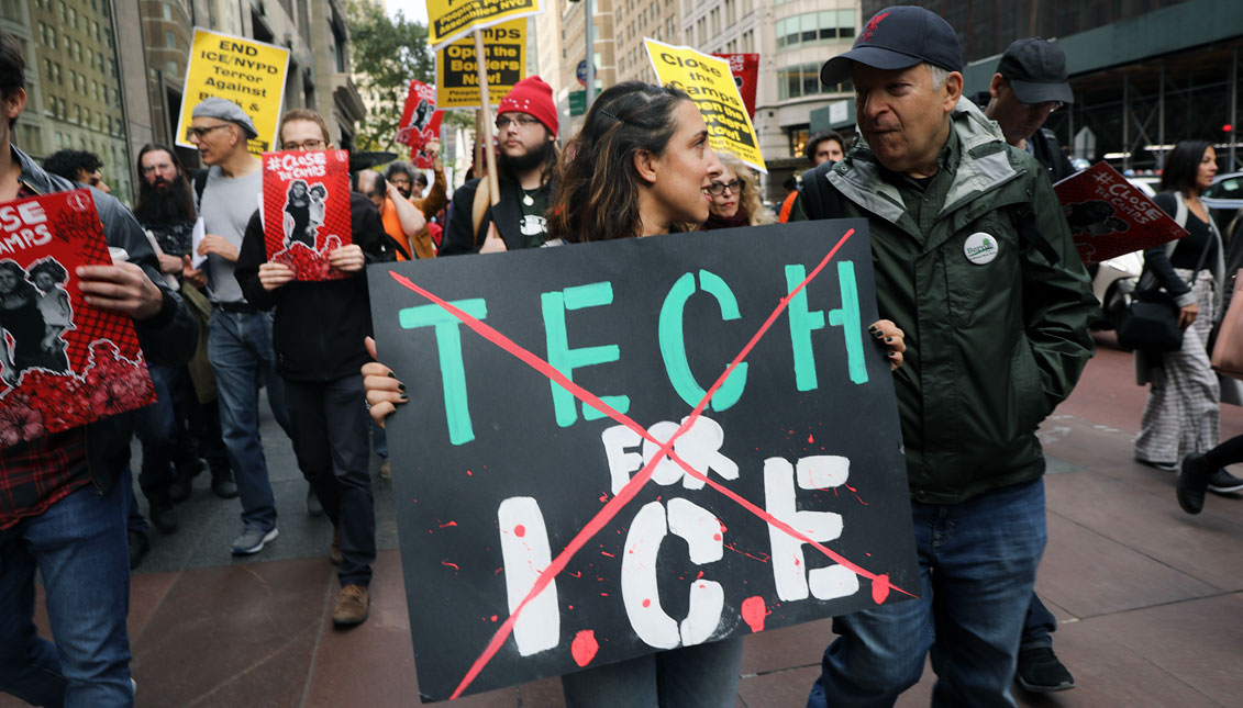 Immigrant rights protesters participate in a demonstration to draw attention to tech companies involvement in the immigration enforcement system on October 11, 2019 in New York City. (Photo by Spencer Platt/Getty Images)