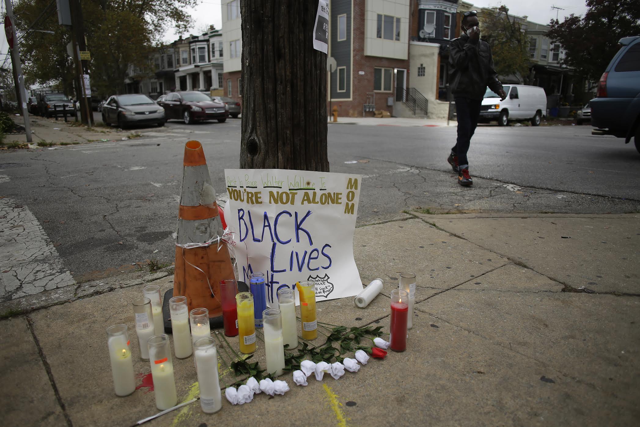 Candles and plastic roses rest at a memorial for Walter Wallace Jr. in the 6100 block of Locust Street on October 28, 2020 in Philadelphia, Pennsylvania. Photo: Joshua Lott/ The Washington Post via Getty Images.