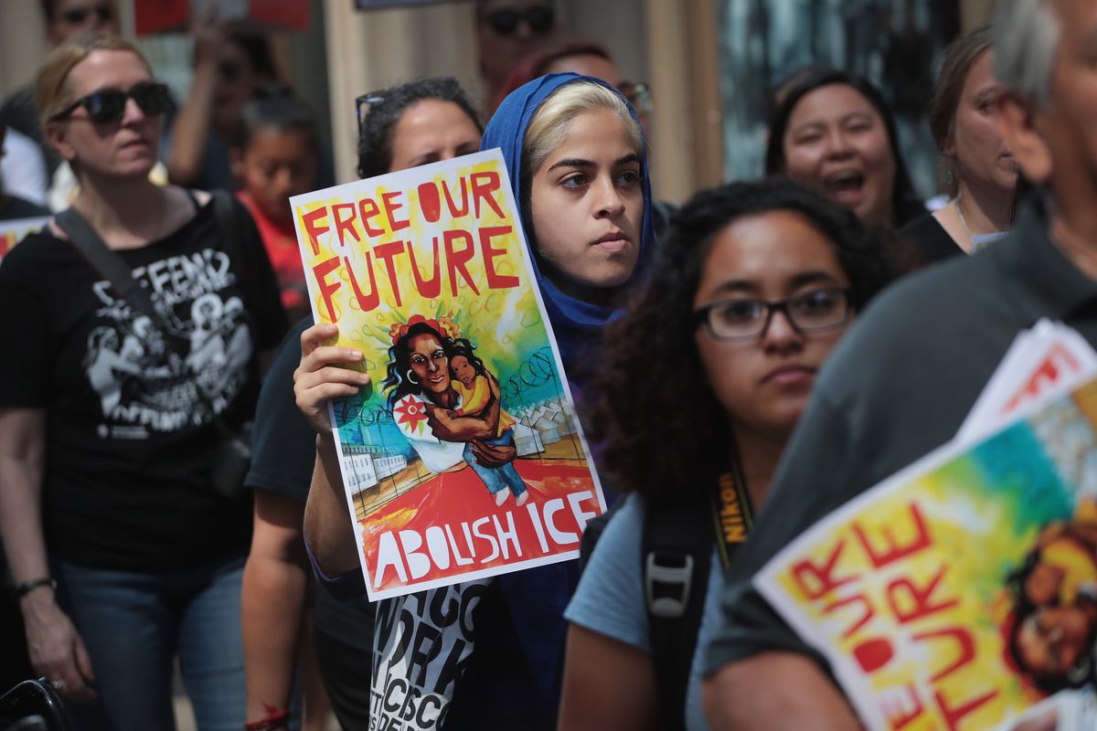 Demonstrators march through downtown Chicago on August 16, 2018, to call for the abolition of US Immigration and Customs Enforcement (ICE) and the defunding of local police. Scott Olson/Getty Images 