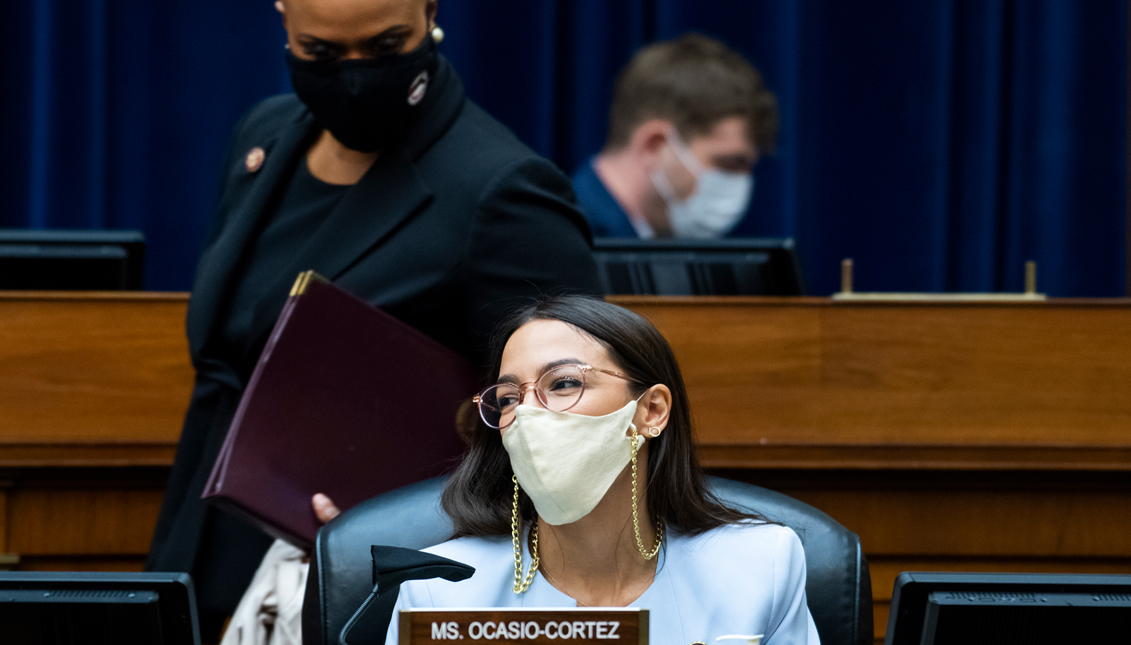 Reps. Alexandria Ocasio-Cortez (D-NY) and Rep. Ayanna Pressley (D-MA) are seen during a hearing before the House Oversight and Reform Committee on August 24, 2020 in Washington, DC. The committee is holding a hearing on "Protecting the Timely Delivery of Mail, Medicine, and Mail-in Ballots." (Photo by Tom Williams-Pool/Getty Images)