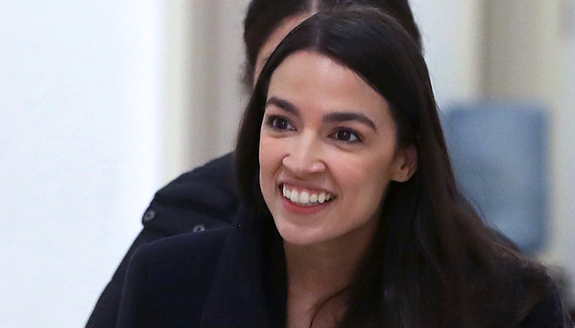 AOC presses a reluctant Louis DeJoy on conflict of interest, experience, and local issues. Photo: Getty Images
