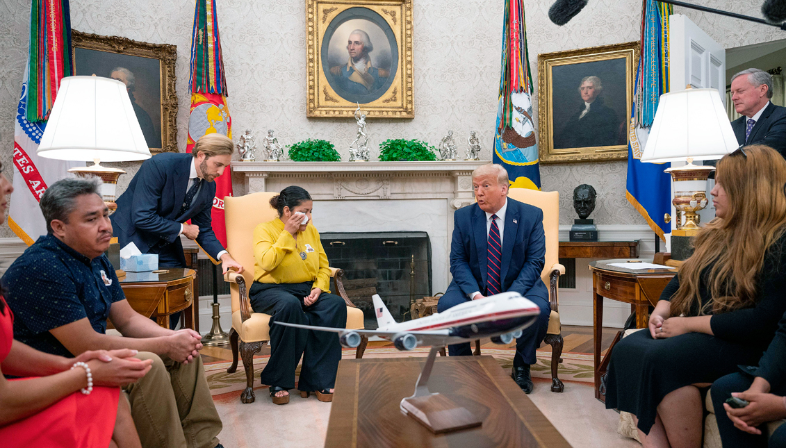 US President Donald Trump (4th R) speaks with Gloria Guillen (4th L), the mother of Vanessa Guillen, a Fort Hood soldier found dead after disappearing from Fort Hood, Texas, and family members in the Oval Office of the White House in Washington, DC, on July 30, 2020. Getty Images
