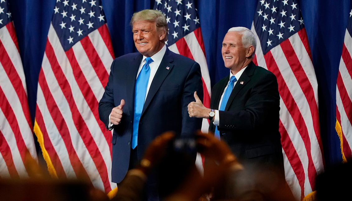 CHARLOTTE, NORTH CAROLINA - AUGUST 24: President Donald Trump and Vice President Mike Pence give a thumbs up after speaking on the first day of the Republican National Convention at the Charlotte Convention Center on August 24, 2020 in Charlotte, North Carolina. The four-day event is themed "Honoring the Great American Story." (Photo by Chris Carlson-Pool/Getty Images) 
