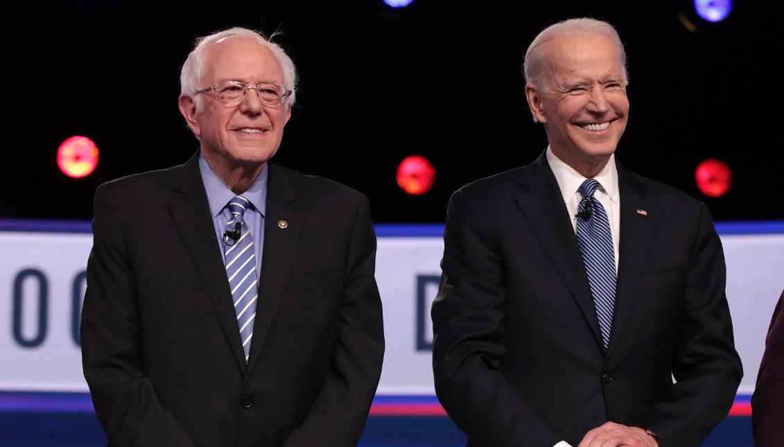 CHARLESTON, SOUTH CAROLINA - FEBRUARY 25:  Democratic presidential candidates Sen. Bernie Sanders (I-VT) and former Vice President Joe Biden arrive on stage for the Democratic presidential primary debate at the Charleston Gaillard Center on February 25, 2020, in Charleston, South Carolina. Seven candidates qualified for the debate, hosted by CBS News and Congressional Black Caucus Institute.  (Photo by Scott Olson/Getty Images)