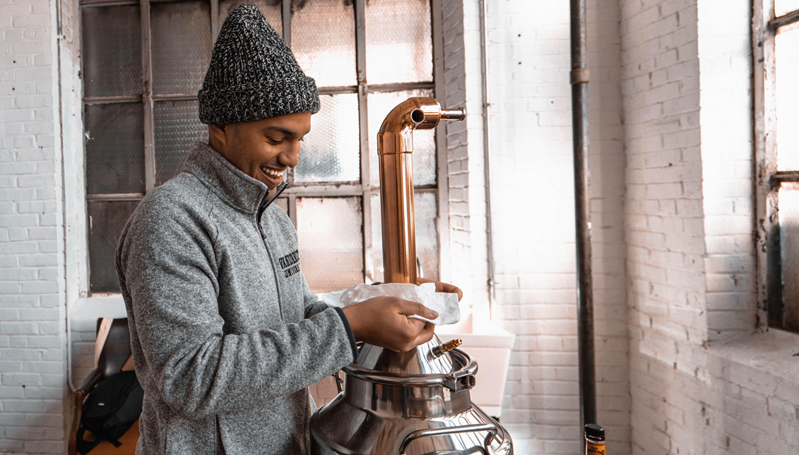 The Brooklyn native has made history by being the first Latino to own a distillery in Philadelphia. Photo credit: Jesse Smallwood.
