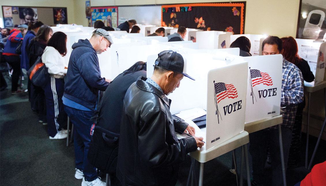 Voters cast their US Presidential ballots after waiting in a line of nearly four-hours long during weekend early voting at a polling place in North Hollywood, California 05 November 2016. File.