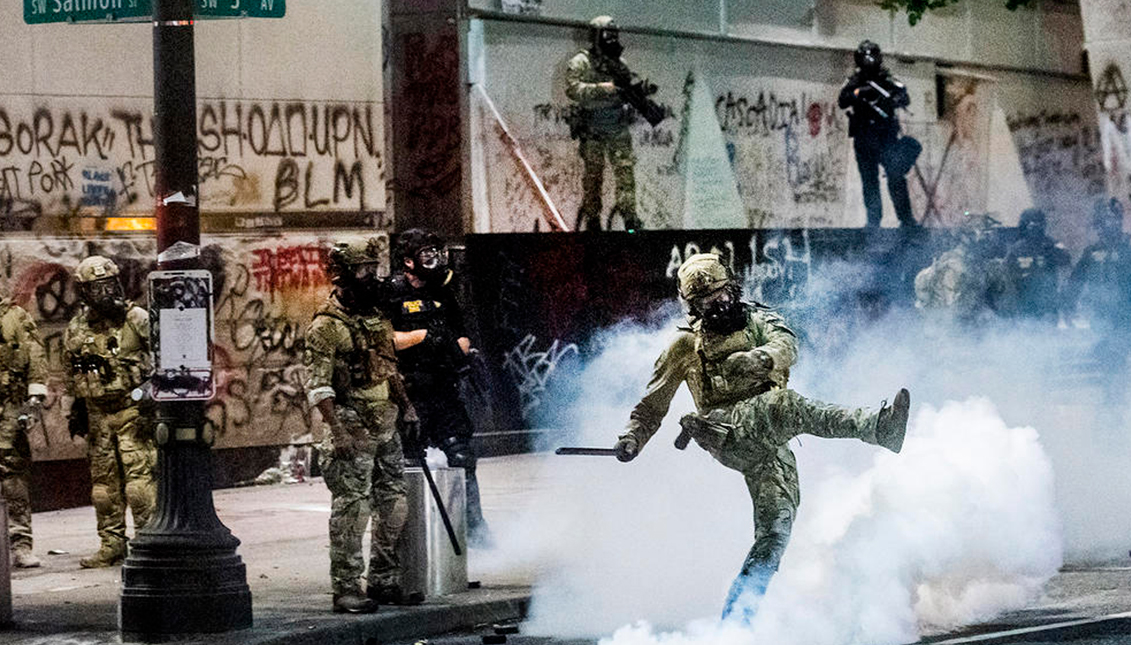 Federal officials use crowd control ammunition to disperse Black Lives Matter protesters outside the Mark O. Hatfield U.S. Courthouse on Tuesday, July 21, 2020, in Portland, Ore. (AP Photo/Noah Berger)