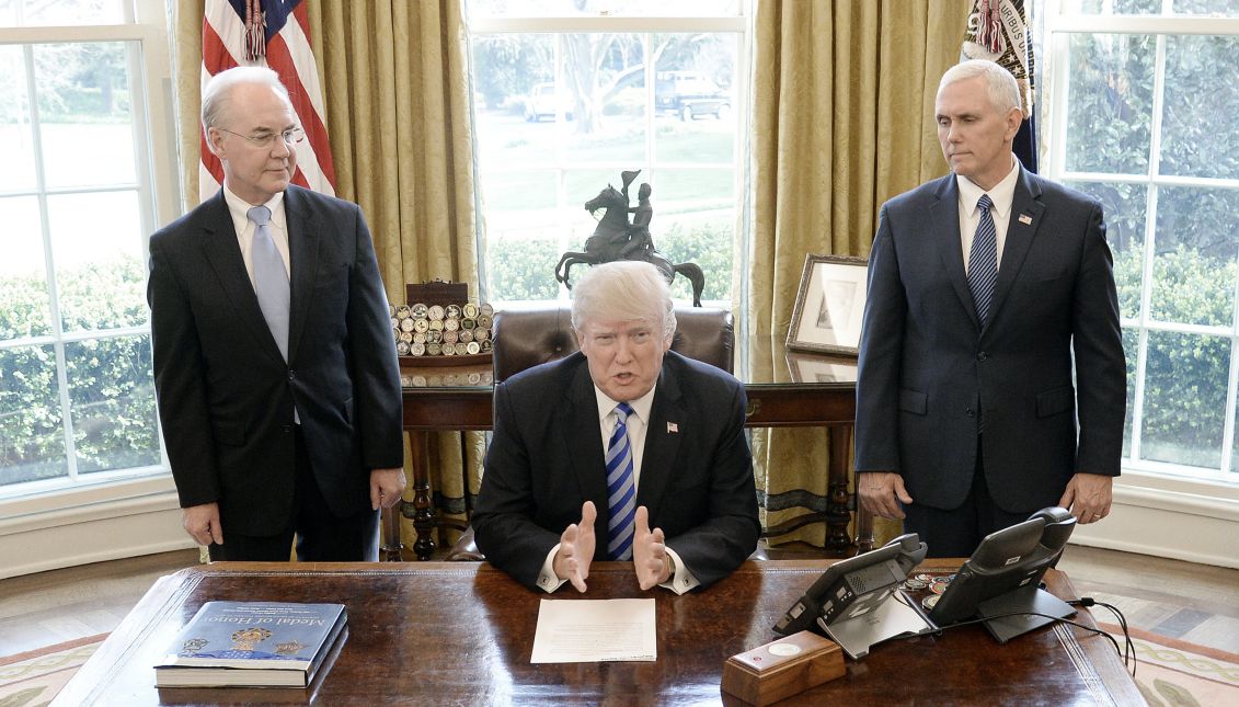 US President Donald Trump reacts after Republicans pulled their health care bill from the House floor on Friday in the Oval Office of the White House in Washington, DC, 24 March 2017, as US Vice President Mike Pence (R) and US Secretary of Health and Human Services (HHS) Tom Price (L) look on. EPA/Olivier Douliery / POOL