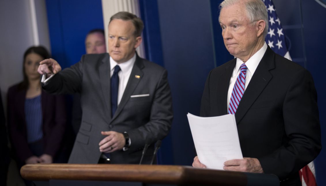 US Attorney General Jeff Sessions (R), with White House Press Secretary Sean Spicer (L), responds to a question from the news media during the daily briefing in the Brady Press Briefing Room at the White House in Washington, DC, USA, 27 March 2017. EPA/SHAWN THEW