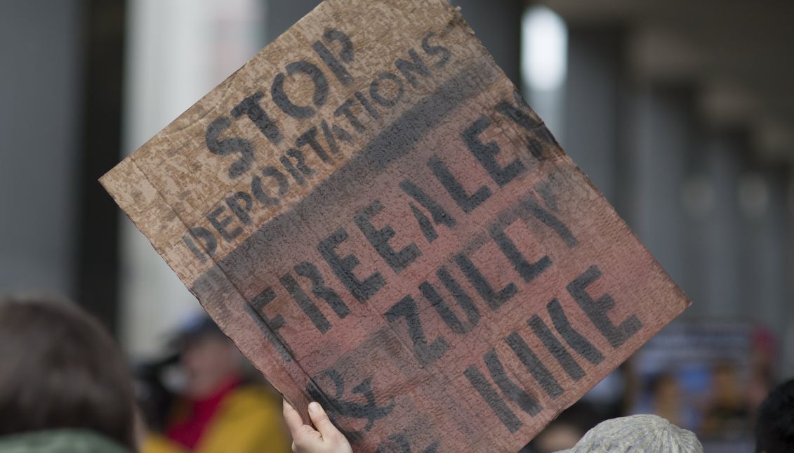 A protester holds a sign demanding the release of two activists, Zully Palacios and Enrique Balcazar, who are community organizers with Migrant Justice, and detained migrant worker Alex Carrillo, outside the John F Kennedy Federal Building in Boston, Massachusetts, USA 27 March 2017.
