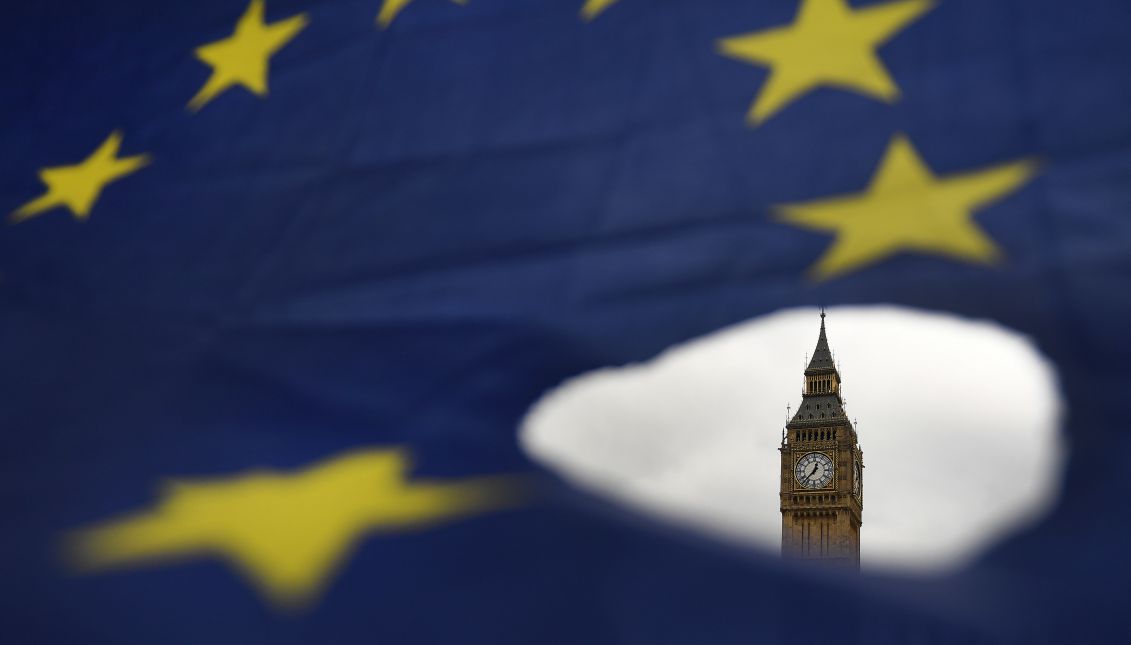 A European Union flag during a demonstration against Brexit outside the Houses of Parliament in London, Britain, Mar. 29, 2017. EPA/ANDY RAIN
