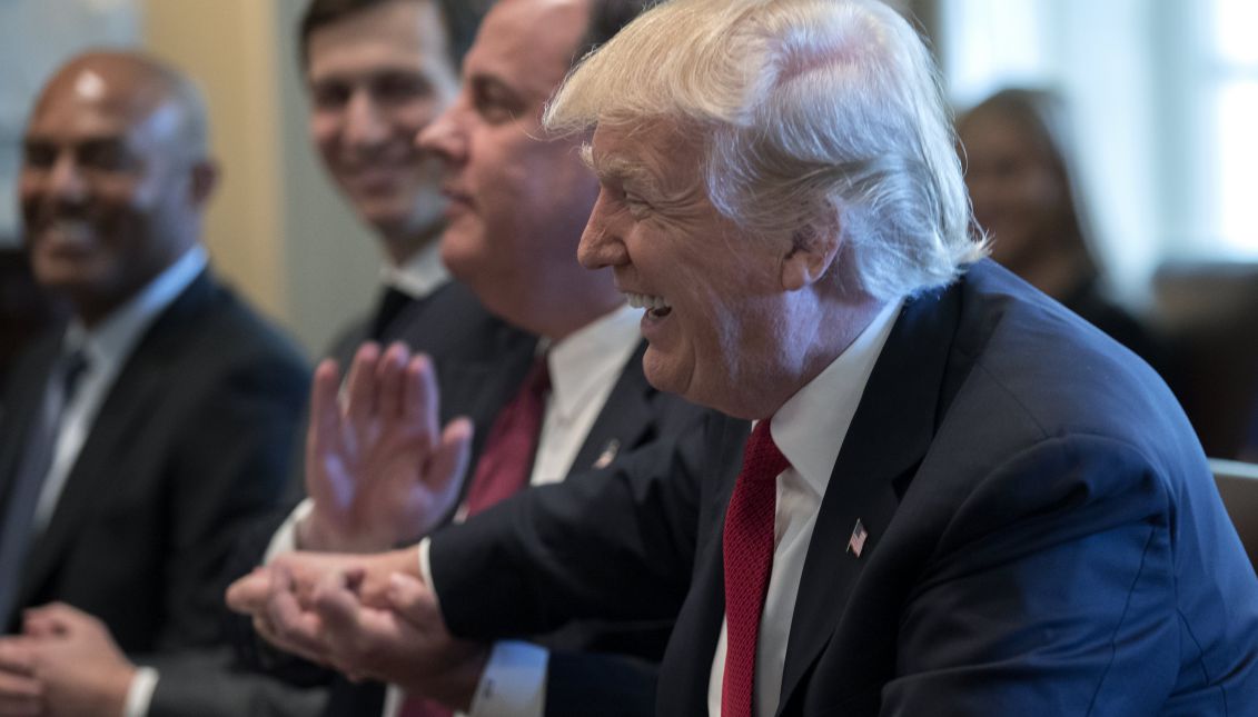 US President Donald J. Trump (R) laughs with New Jersey Governor Chris Christie (2-R) during an opioid and drug abuse listening session in the Roosevelt Room of the White House in Washington, DC, USA, 29 March 2017. EPA/SHAWN THEW
