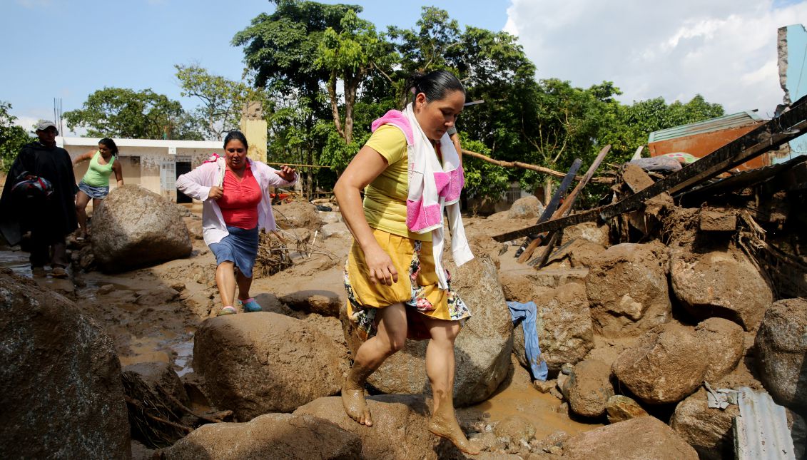 Residents of Mocoa, Colombia, move among the city's ruins on April 2, 2017, after a mudslide wiped away portions of 17 neighborhoods, killing more than 200 people. EFE/LEONARDO MUÑOZ