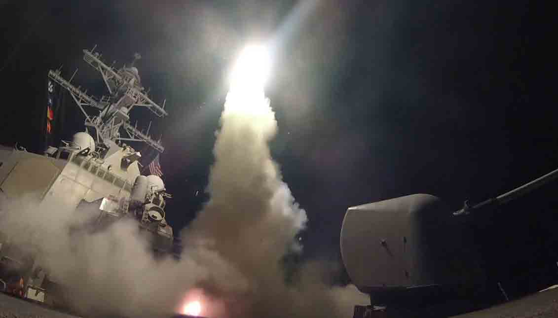 A handout photo made available by the US Navy Office of Information shows the guided-missile destroyer USS Porter (DDG 78) launching a missile strike while in the Mediterranean Sea, Apr. 7, 2017. EPA
