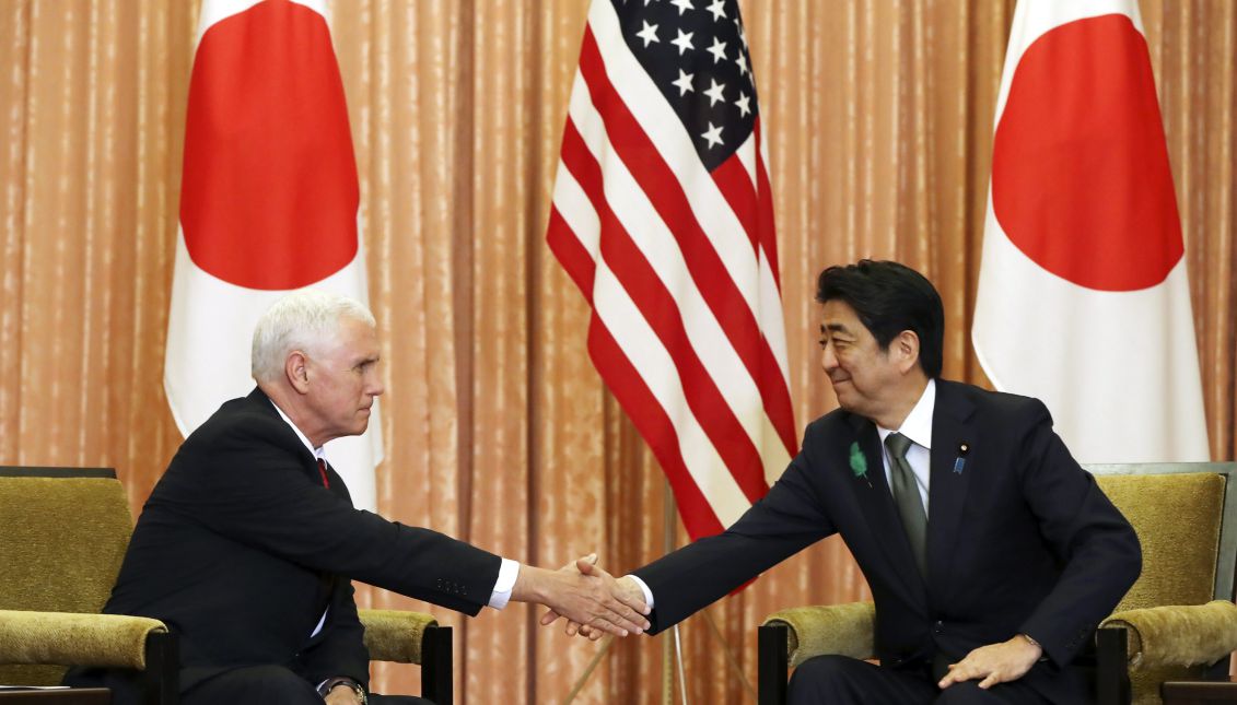 Japanese Prime Minister Shinzo Abe (R) and US Vice President Mike Pence (L) shake hands prior to a luncheon hosted by Abe at the prime minister's official residence in Tokyo, Japan, 18 April 2017. EPA/EUGENE HOSHIKO / POOL
