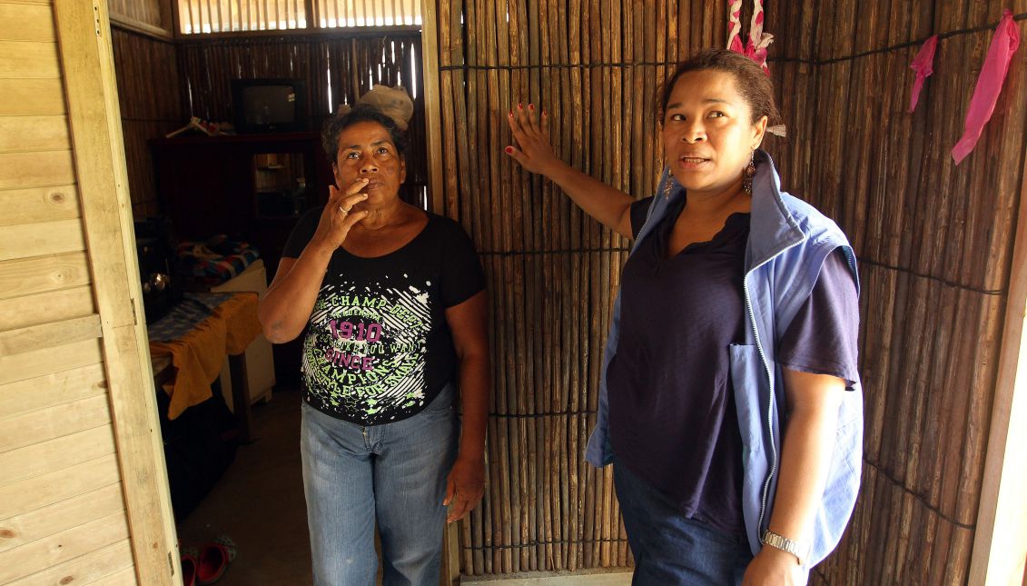 Neida Zambrano (l) and the head of the local United Nations project to adapt to climate change, Diana Diaz (r), give a tour of a new house adapted to global warming in the Colombian town of El Torno on April 22, 2017. The town was seriously affected in 2010 by flooding, which destroyed crops and homes, but today the community of 600 residents is an example of resilience and sustainable adaptation to climate change. EFE/Mauricio Dueñas Castañeda
