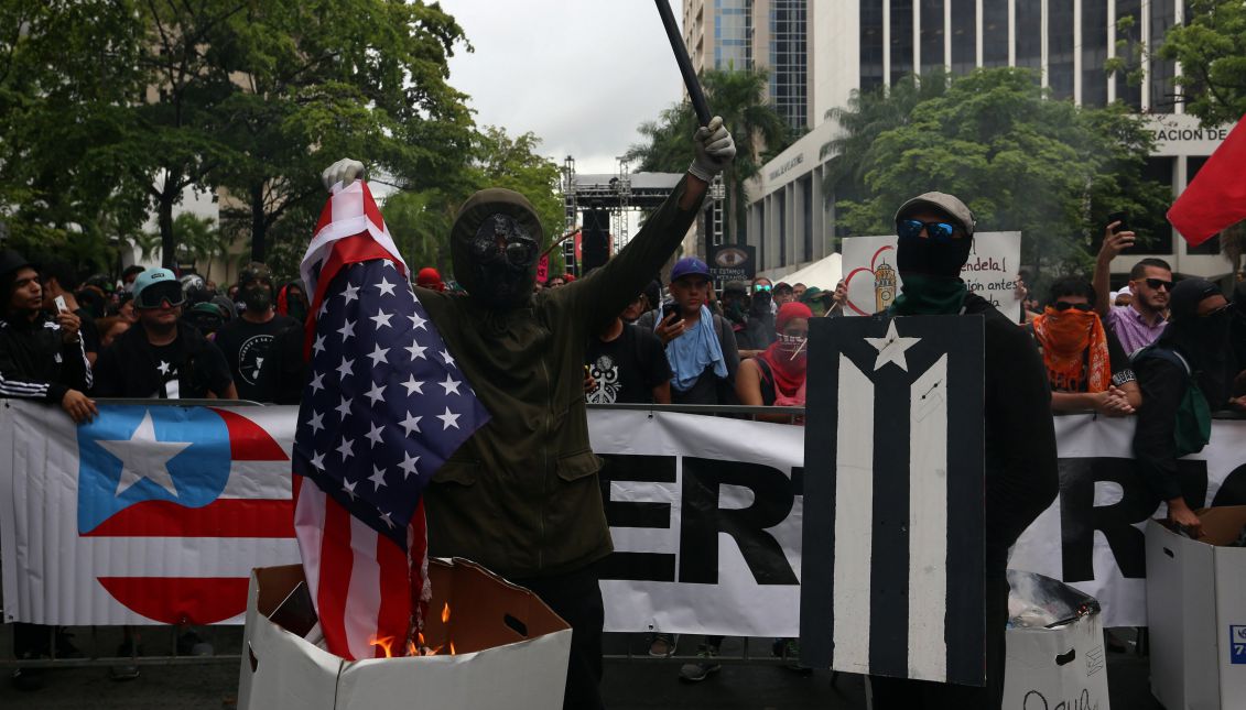 People demonstrate during the general strike against austerity measures, which coincides with the International Workers Day, in San Juan, Puerto Rico, May 1, 2017. EFE/THAIS LLORCA