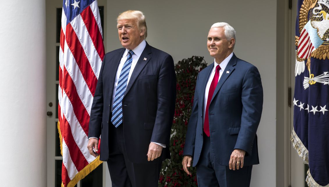 US President Donald J. Trump and Vice President Mike Pence (R) arrive at an event where Trump later signed an executive order that the White House says 'promotes free speech and religious liberty' and participates in a National Day of Prayer event in the Rose Garden of the White House in Washington, DC, USA, 04 May 2017. EPA/JIM LO SCALZO
