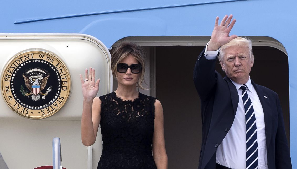 US President Donald J. Trump (R) and US First Lady Melania Trump (L) wave as they board the 'Air Force One' plane at the 'Leonardo da Vinci' airport in Fiumicino, near Rome, Italy, 24 May 2017, on their way to Brussels, the next leg of his first presidential tour. EPA/ANGELO CARCONI
