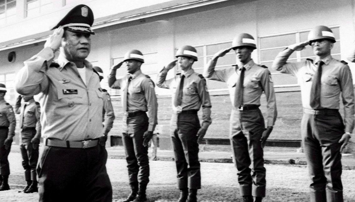 Panamanian dictator Manuel Antonio Noriega (L) salutes troops at an undisclosed location in Panama, 1985 (reissued May 30, 2017). EPA/STF
