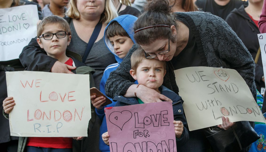 Supporters hold signs of condolence for the victims of the London attacks, outside the County Hotel where Britain's Labor Party leader Jeremy Corbyn is delivering a campaign speech in Carlisle, Britain, 04 June 2017. EPA/ROBERT PERRY
