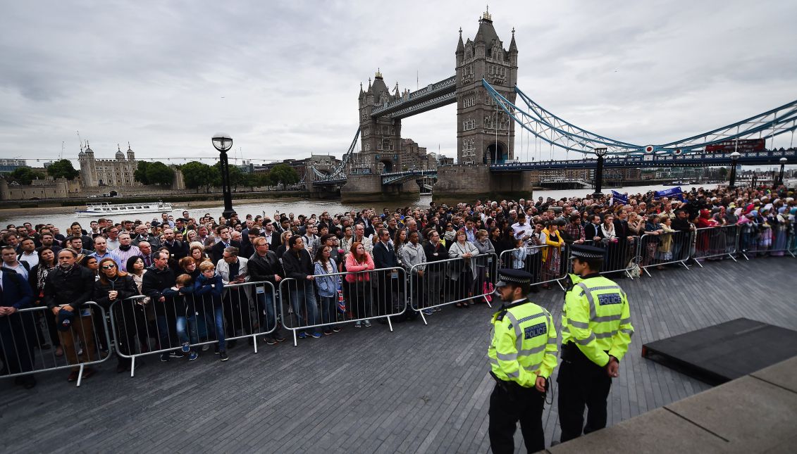 People take part in a vigil for victims of the London Bridge terror attacks by the City Hall in London, Britain, 05 June 2017. EPA/ANDY RAIN