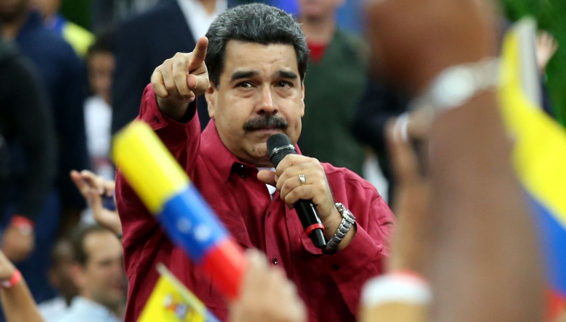 A handout photo made available by the Press Office of Miraflores Palace shows Venezuelan President, Nicolas Maduro (C), during a rally of supporters in Caracas, Venezuela, 27 June 2017. EPA/MIRAFLORES PALACE 
