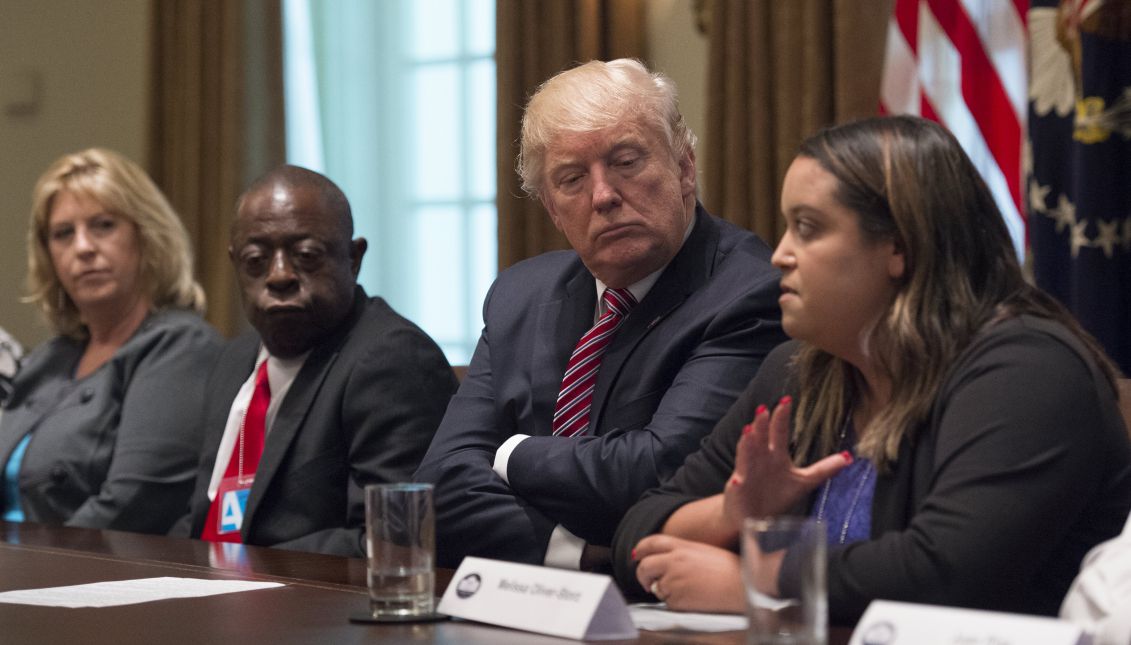 US President Donald J. Trump (C) listens as he meets with immigration crime victims to urge passage of House legislation to save American lives, in the Cabinet Room at the White House, Washington, DC, USA, 28 June 2017. EPA/Molly Riley / POOL