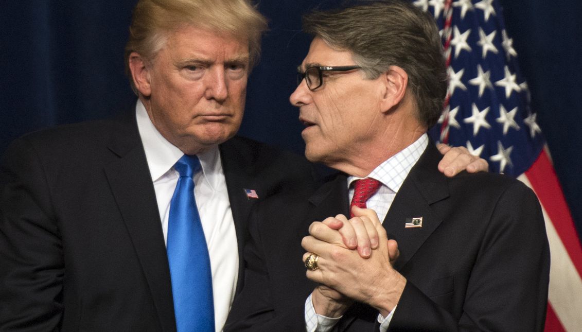 President Donald Trump (L) embraces Energy Secretary Rick Perry (R) after delivering remarks at the Unleashing American Energy event at the Department of Energy in Washington, DC, USA, 29 June 2017. EPA/KEVIN DIETSCH / POOL