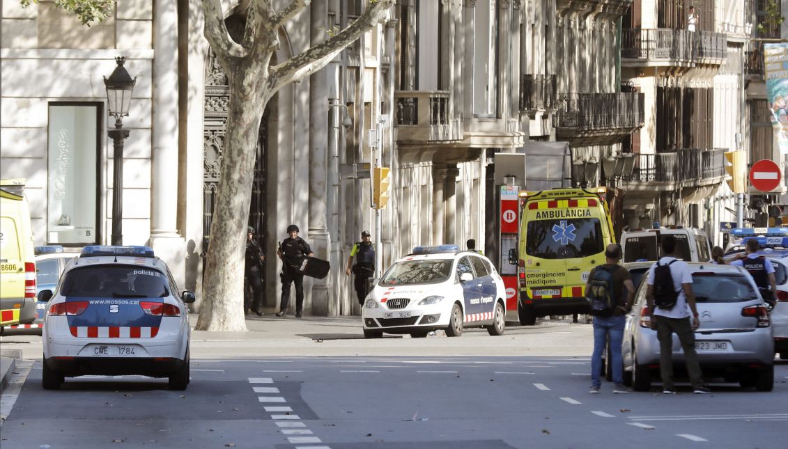 Police and emergency services at the scene where a van hit pedestrians in Barcelona, Spain, Aug. 17, 2017. EFE/Andreu Dalmau