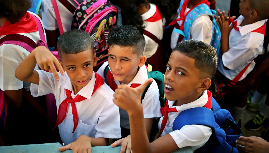 Three children pose for a photo during the start date of the 2017-2018 school year, in Havana, Cuba on Sept. 4, 2017. EPA-EFE/Alejandro Ernesto