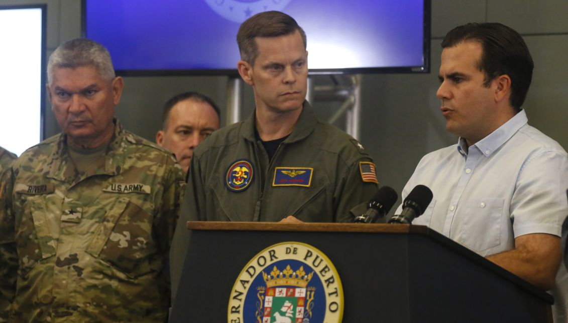 Puerto Rican Governor Ricardo Rossello (R) speaks next to US Admiral Jeffrey Hughes (C) during a press conference at the Government's Command Center in San Juan, Puerto Rico, Sept. 28, 2017. EPA-EFE/Thais Llorca