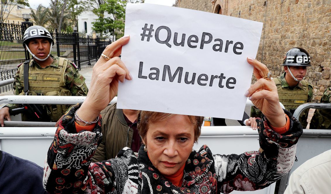 Human rights activists and social organizations protest to demand the implementation of the substitution of illicit crops in the country, in Bolivar Square in Bogota, Colombia, Oct. 6, 2017. Banner reading "Stop the Death." The protest was called following the death of at least six coca farmers in an unclear attack in Tumaco, in rural southeastern Colombia, one of the municipalities with more coca hectares in the country, media reported. EPA-EFE/LEONARDO MUÑOZ
