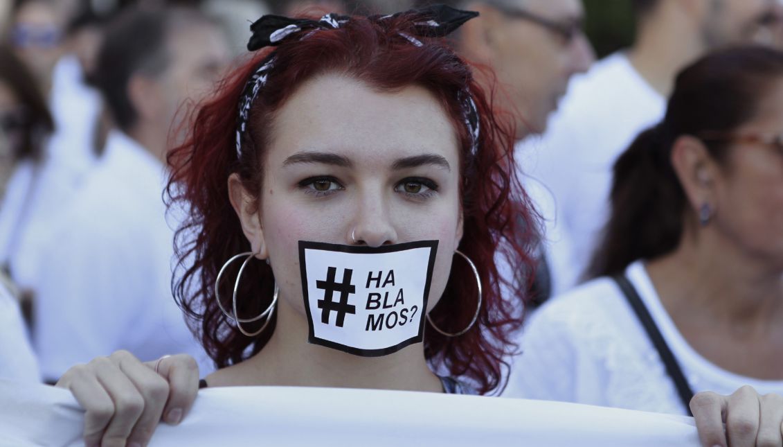 A girl wearing a selfmade mask reading 'Are we talking?' attend a demonstration called by platform 'Hablamos?' at Cibeles square in Madrid, Spain, 07 October 2017, to make a call for dialogue after the Catalan Independence Referendum held on 01 October. EPA-EFE FILE/Victor Lerena
