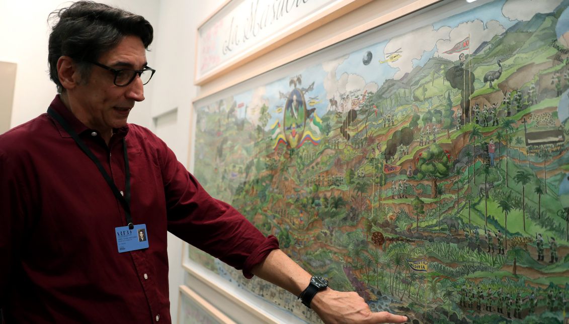 Colombian artist Jorge Julian Aristizabal speaks about one of his works at the Bogota International Art Fair on Oct. 29, 2017. EFE/Mauricio Dueñas Castañeda
