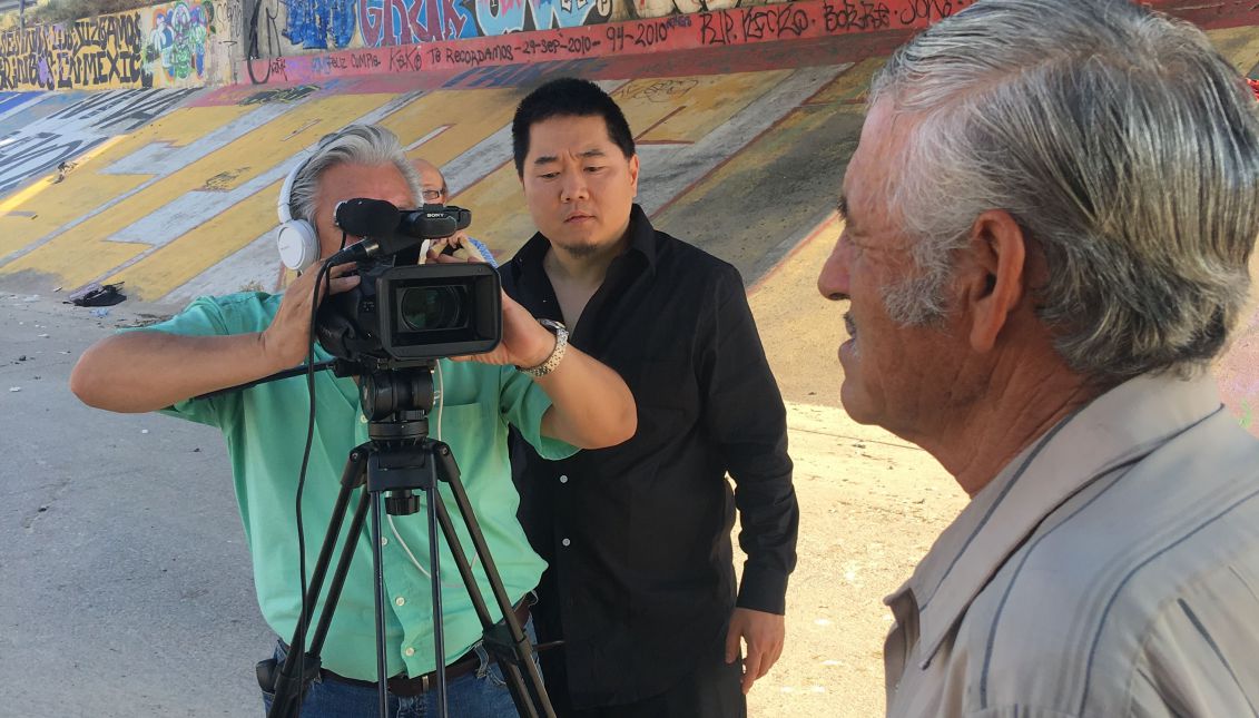 Undated photo showing Filmmaker Charlie Minn (C), interviewing Jesus Hernandez (R), father of Sergio Hernandez Güereca, a 15-year-old resident of Ciudad Juarez, Mexico just across the Rio Grande from El Paso, USA, who was fatally shot by US Border Patrol agent Jesus Mesa on June 7, 2010, in Ciudad Juarez, Mexico. EPA-EFE/Charlie Minn
