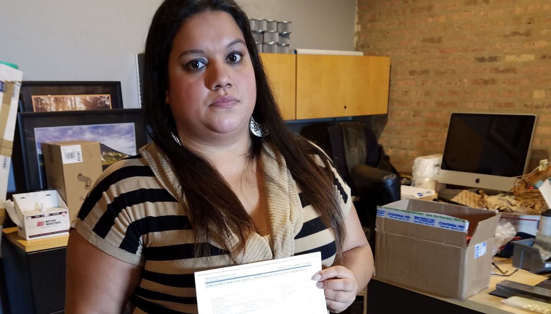 Venezuelan Deferred Action for Childhood Arrivals program (DACA) beneficiary Laura Rodriguez holds her eligibility renewal documentation, rejected by immigration authorities because it did not arrive in time due to errors with mail delivery, in Chicago, USA on Nov. 15, 2017. EPA-EFE/Enrique García Fuentes
