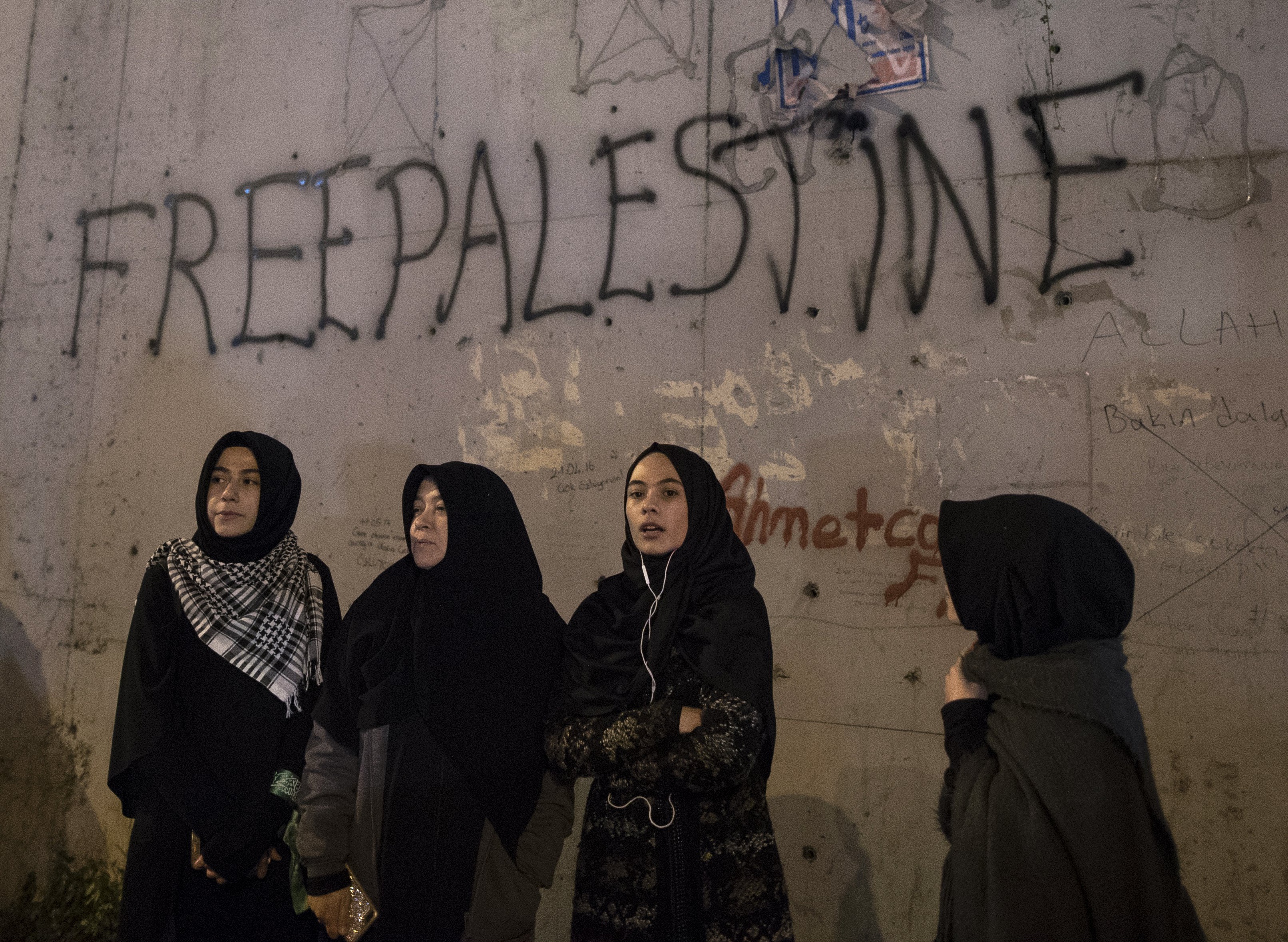 Protestors stand and wait before a protest against the Israel in front of US Consulate in Istanbul, Turkey, Dec. 6, 2017