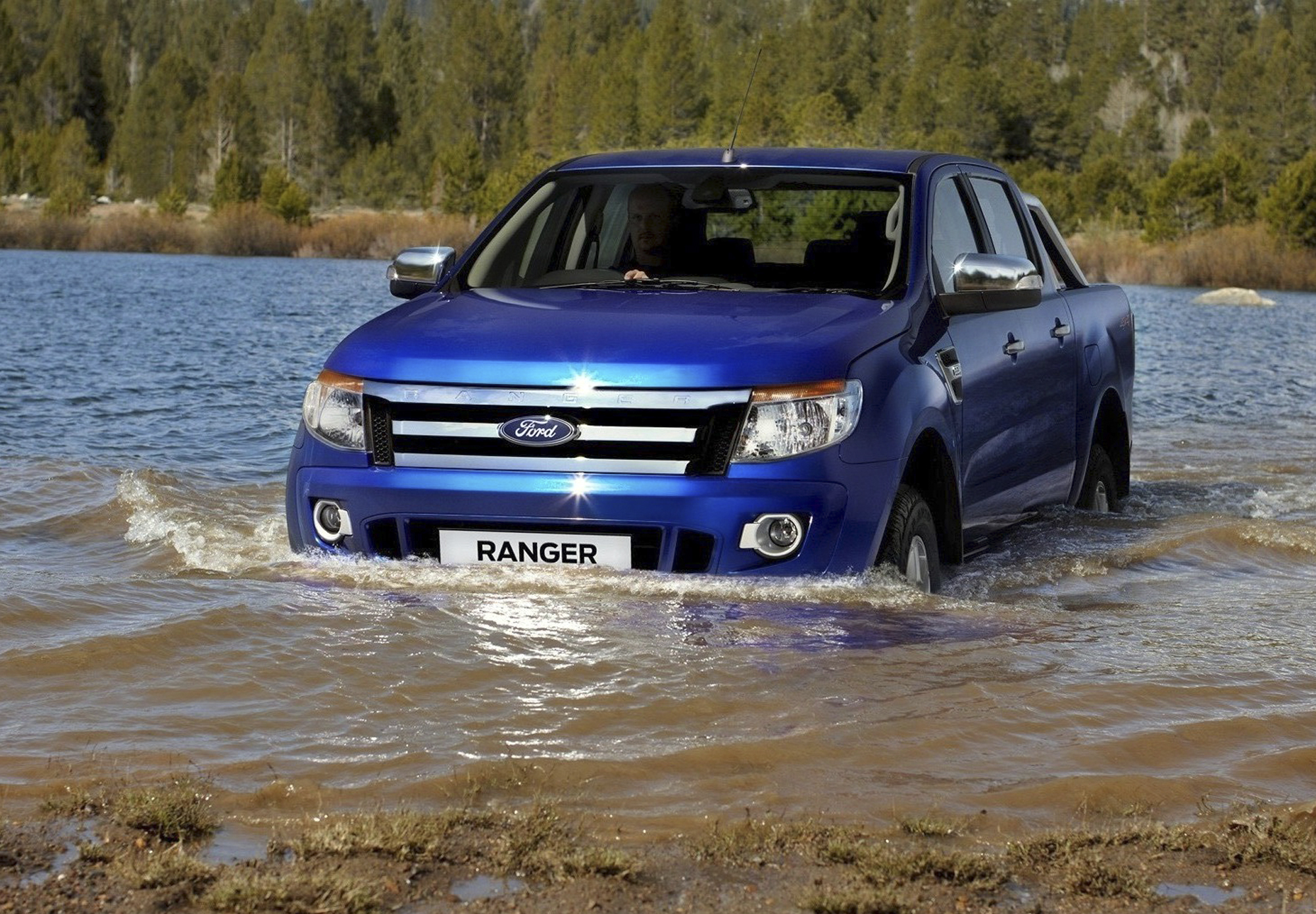 An undated handout photo released by Ford Motor Company on Mar. 23, 2011 shows a new Ford Ranger pickup truck drives through a stream at an undisclosed location.
