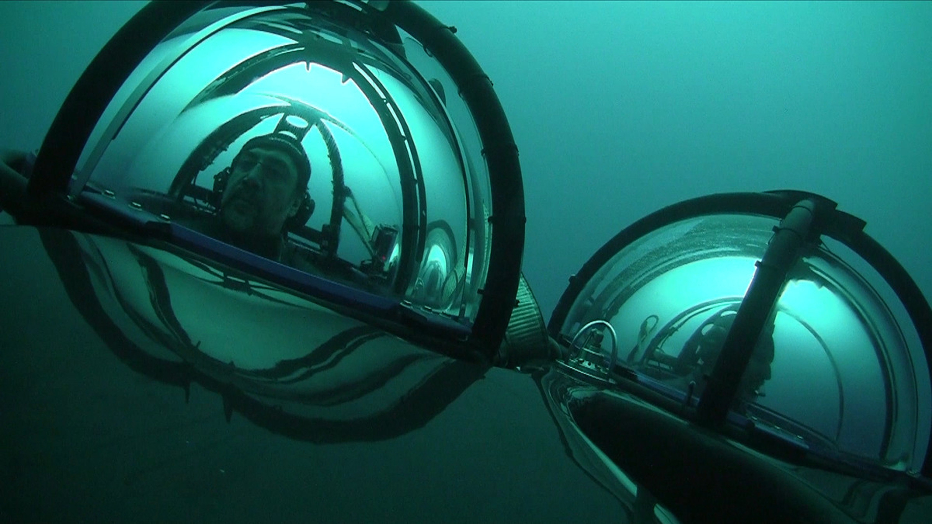 Photo made available by the Greenpeace organization on Jan. 30, 2018 shows Spanish actor Javier Bardem (L), in a two-man submarine navigated by a Greenpeace's marine biologist (R), in the Antarctic Ocean, near the Antarctic Peninsula, Chile, Jan. 24, 2018.
