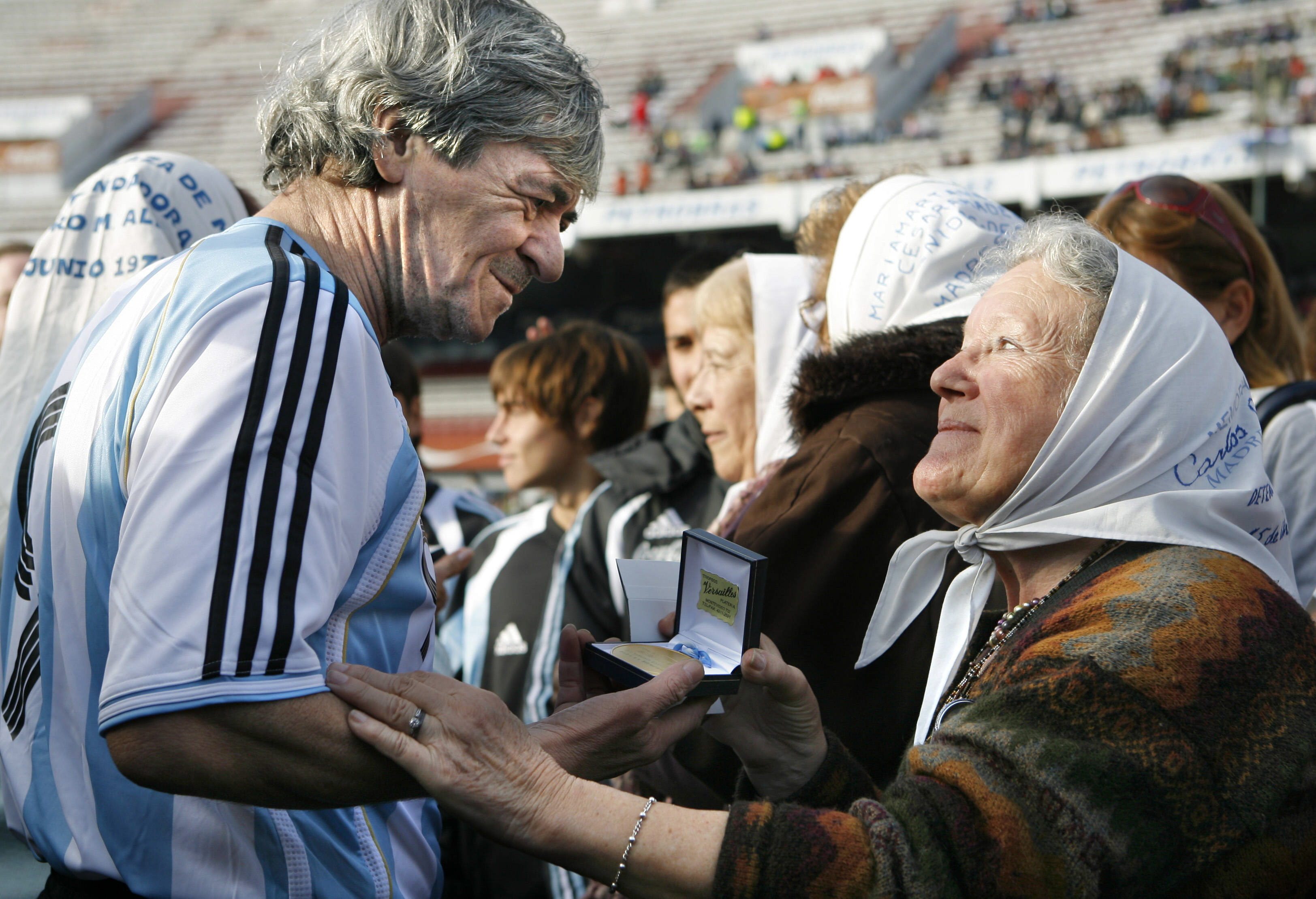 Argentine former soccer player Rene "el Loco" Houseman (L) receives a medal commemorating the 30 anniversary of Argentina's soccer national team winning the World Cup, in Buenos Aires, Argentina, June 29, 2008. EPA-EFE FILE/Cezaro De Luca